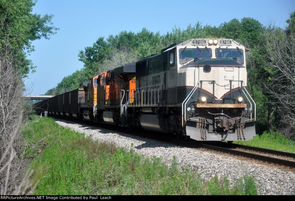 Loaded coal train rolls east